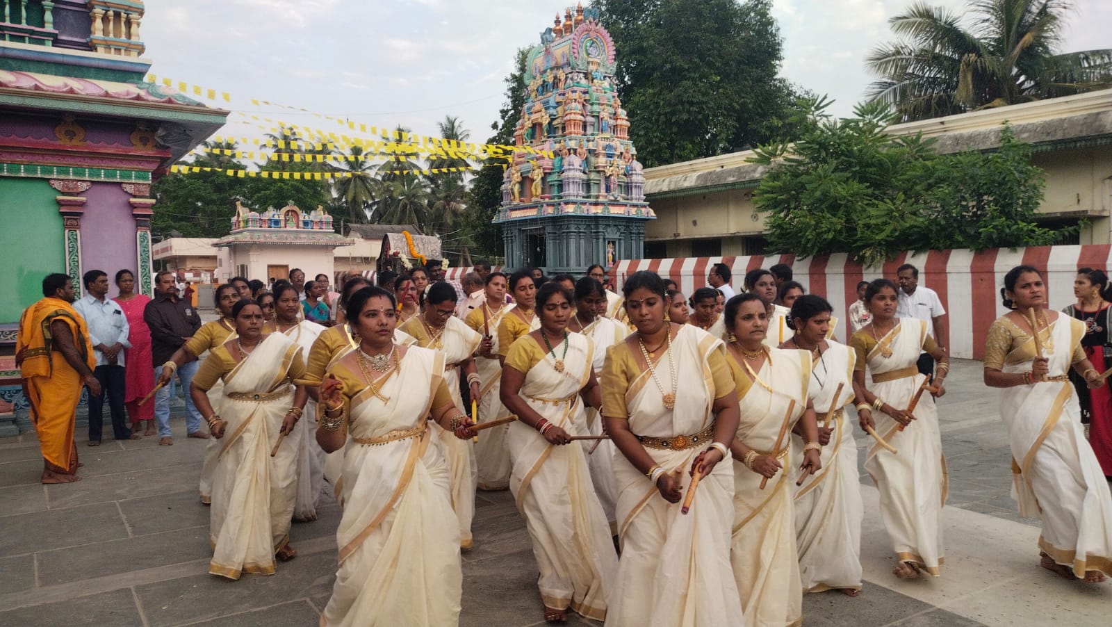 Devotees participating in a traditional temple procession