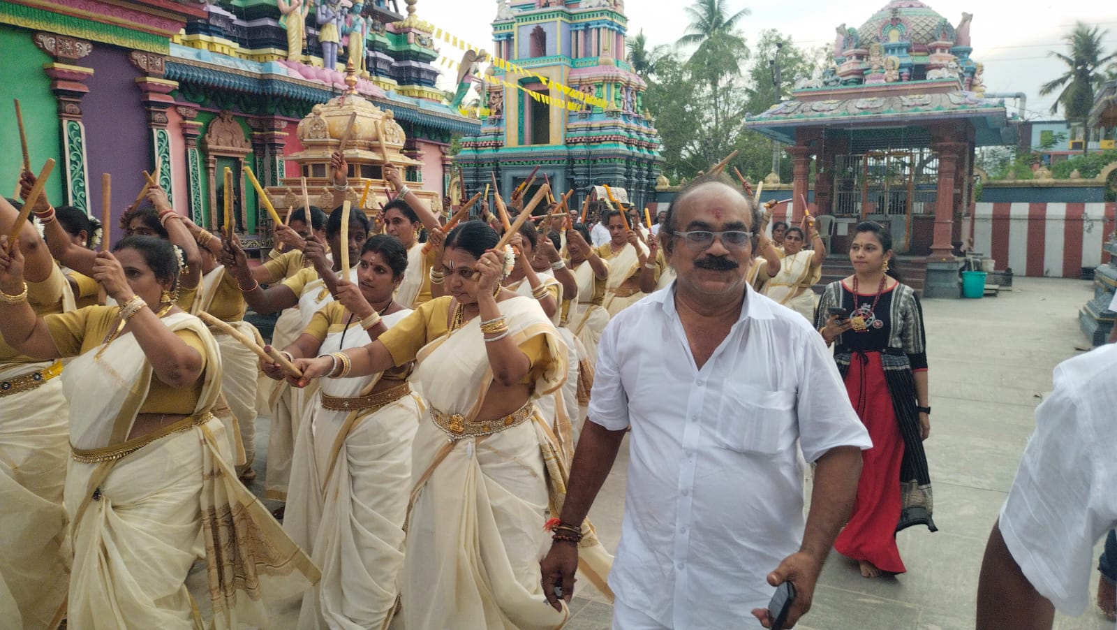 Temple devotees taking part in a festive procession