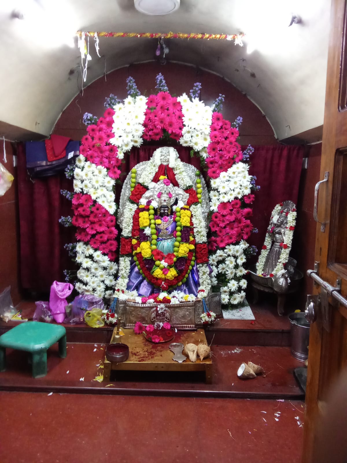 Temple shrine decorated with a floral garland arrangement